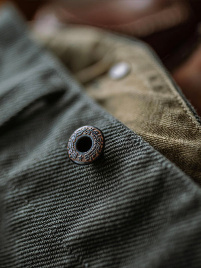 Pantalones resistentes de granito de 21.5 oz